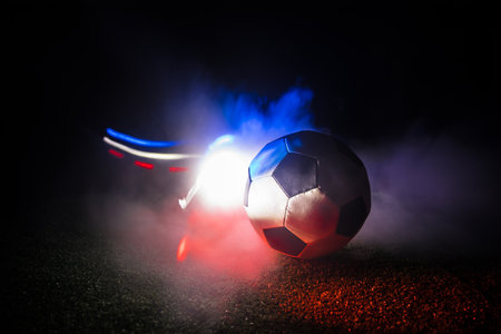 Soccer 2022. Grand Final Argentina vs France theme. soccer ball on green grass. Support your country or cheer concept. selective focusの写真素材