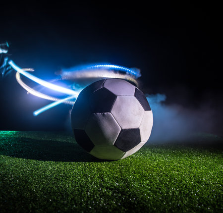 Soccer 2022. Grand Final Argentina vs France theme. soccer ball on green grass. Support your country or cheer concept. selective focusの写真素材