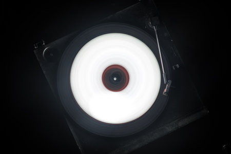 Music DJ concept. Trail of fire and smoke on vinyl record. Burning vinyl disk. Turntable vinyl...