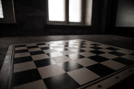 Chess board game concept of business ideas and competition. Empty chessboard on wooden table. dark...