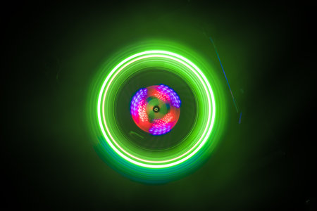 Music DJ concept. Trail of fire and smoke on vinyl record. Burning vinyl disk. Turntable vinyl...