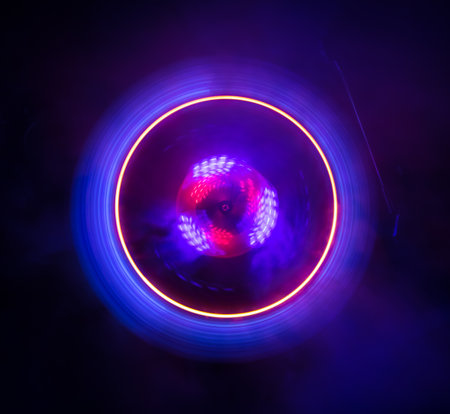 Music DJ concept. Trail of fire and smoke on vinyl record. Burning vinyl disk. Turntable vinyl record player on dark background. selective focusの写真素材
