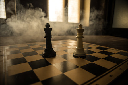 Chess board game concept of business ideas, competition and strategy. Chess figures on a dark background with smoke and fog. selective focusの写真素材