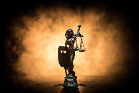 No law or dictatorship concept. The Statue of Justice with anti-riot police helmet holding scale. Creative artwork decoration with colorful toned foggy background. selective focusの写真素材