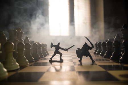 Medieval battle scene with cavalry and infantry on chessboard. Chess board game concept of business...
