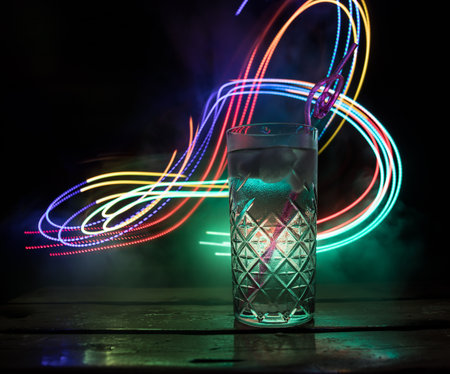 colorful cocktail in glass on dark background or Glasses of cocktails on bar background.Party club...