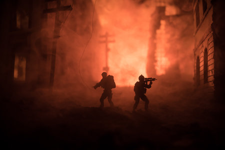 Army sniper with large caliber rifle standing in the fire and smoke. War concept. Battle scene on war fog sky background, Fighting silhouettes Below Cloudy Skyline at night. city destroyed by warの写真素材