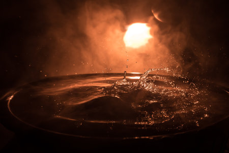 Water splash on dark foggy background. selective focus.の写真素材