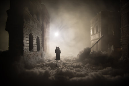 War apocalypse concept. Snow covered ruined city destroyed by war. Refugees and civilians silhouettes on dark. Creative artwork decoration in dark. selective focusの写真素材