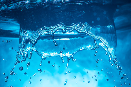 Water splash on dark foggy background. selective focus.