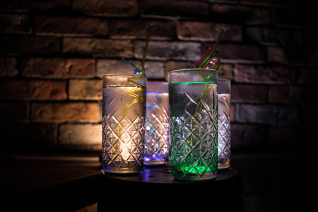colorful cocktail in glass on dark background or Glasses of cocktails on bar background.Party club...