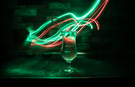 colorful cocktail in glass on dark background or Glasses of cocktails on bar background.Party club...