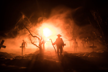 Silhouette of person standing in the dark forest with light. Horror halloween concept. strange silhouette in a dark spooky villageの写真素材