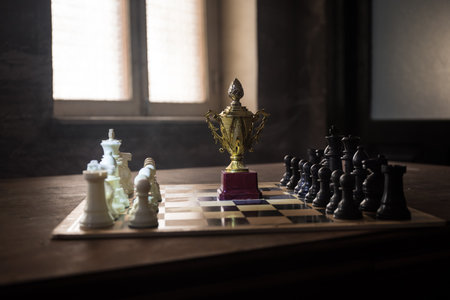Chess board game concept of business ideas, competition and strategy. Chess figures on a dark background with smoke and fog. Selective focusの写真素材