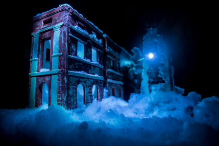War apocalypse concept. Snow covered ruined city destroyed by war. Creative artwork decoration in dark. selective focusの写真素材