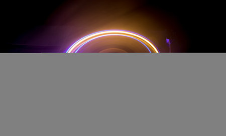 Music DJ concept. Trail of fire and smoke on vinyl record. Burning vinyl disk. Turntable vinyl record player on dark background. selective focusの写真素材