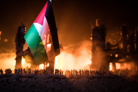 Conflict between Israel and Palestine concept. Burning and destroyed city by war. Concept of crisis of war creative decoration. Selective focusの写真素材