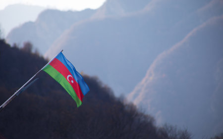 Azerbaijan flag,Waving flag on the mountain. National flag of Azerbaijan on strong wind in the sunny day. Outdoor nature shotの写真素材
