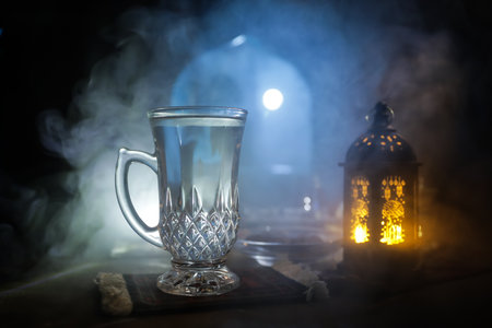 A realistic Arabian interior miniature with window and columns. Meals are served before sunrise called Suhur. Festive greeting card, invitation for Muslim holy month of Ramadan Kareem. Selective focusの写真素材