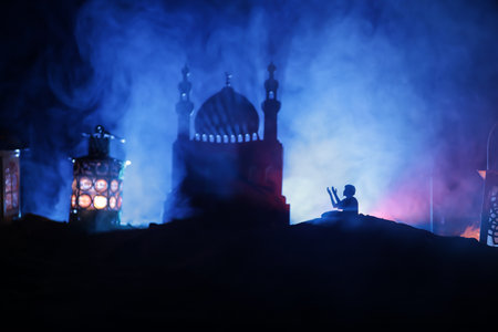 Suhoor or iftar time during Ramadan fasting. A glass of water and dates to break the fast. Festive greeting card, invitation for Muslim holy month of Ramadan Kareem. Selective focusの写真素材