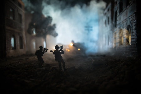 Military soldier silhouette with bazooka. War Concept. Military silhouettes fighting scene on war fog sky background, Soldier Silhouette aiming to the target at night. Attack sceneの写真素材