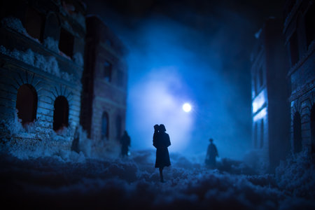 War apocalypse concept. Snow covered ruined city destroyed by war. Refugees and civilians silhouettes on dark. Creative artwork decoration in dark. Selective focusの写真素材