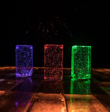 Colorful Glass Bricks Illuminated in Darkness: Vibrant Light Beams Creating a Stunning Futuristic Glowの写真素材