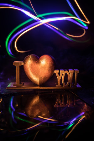 Valentine's Day Concept: A Miniature Table Scene with Items Symbolizing Love, Relationships, and Romance, Including a Heartfelt Love Card, Perfectly Capturing the Spirit of Valentine's Day.の写真素材