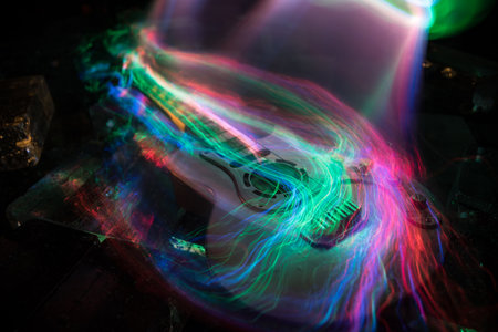 Music Concept: Guitar Miniature on a Dark Background with Vivid Light, Smoke, and Fire Effects....
