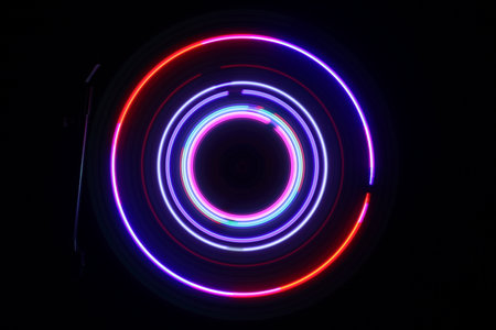 Music DJ concept. Trail of fire and smoke on vinyl record. Turntable vinyl record player on dark background. selective focusの写真素材