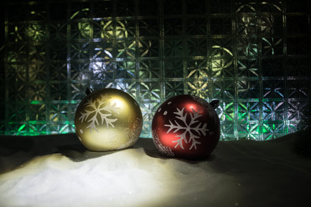Christmas home decoration with snow and tree on a dark background with copy space. Cozy lights in selective focus.の写真素材