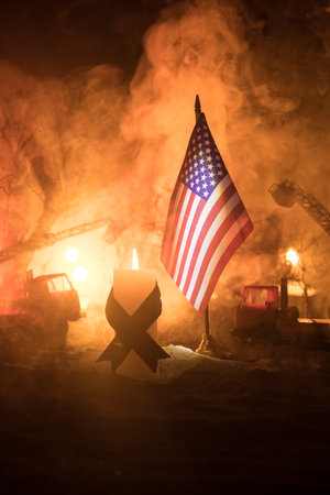 A tabletop diorama of a tragic California wildfire, set in Pacific Palisades near Malibu. Dramatic flames and smoke rise as firefighters battle the blaze, symbolizing climate change's impact.の写真素材