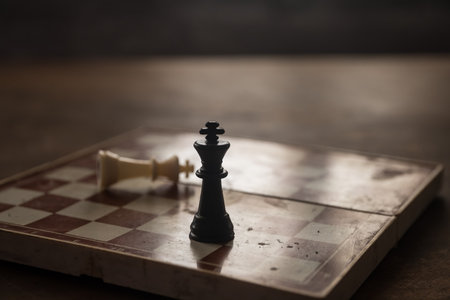 Chess board game concept of business ideas, competition and strategy. Chess figures on a dark background with smoke and fog. Selective focusの写真素材
