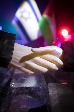 Handshake Between Israel and Palestine: Trump's Mediation for Middle East Peace. Tabletop Miniature. Selective focusの写真素材