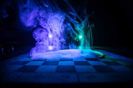 Chess board game concept of business ideas and competition. Chess figures on a dark background with...