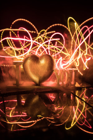 Valentine's Day Concept: A Miniature Table Scene with Items Symbolizing Love, Relationships, and...