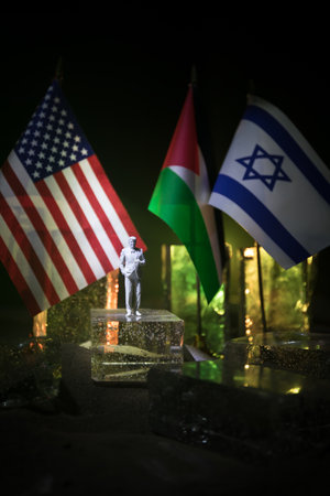Handshake Between Israel and Palestine: Trump's Mediation for Middle East Peace. Tabletop Miniature. Selective focusの写真素材