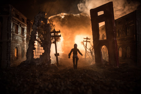 Artwork decoration. A man standing on a road of burnt up city. Apocalyptic view of city downtown as...
