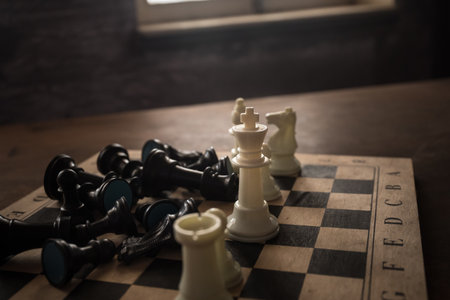 Chess board game concept of business ideas, competition and strategy. Chess figures on a dark...