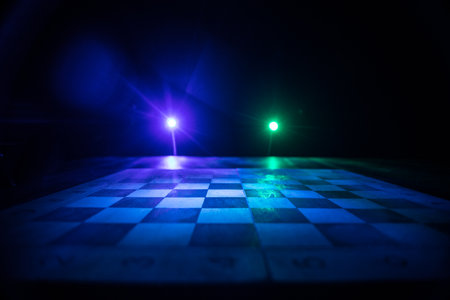 Chess board game concept of business ideas and competition. Chess figures on a dark background. Selective focusの写真素材