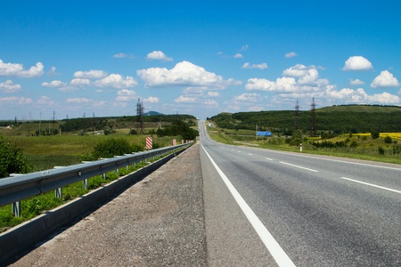 View of the green fields and road, landscape, horizon.  の素材