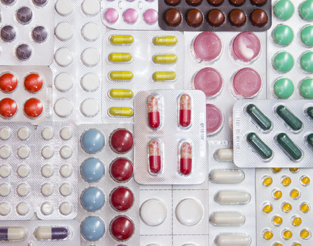 background color of medicines in the blister - vitamins, tablets, capsules