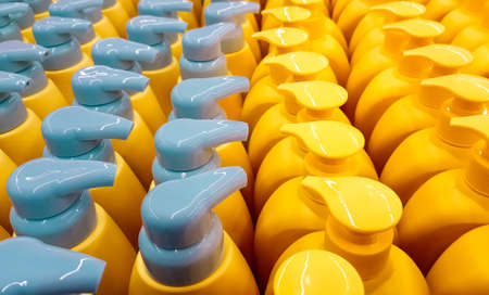 Color plastic bottles with lids in a row.の写真素材