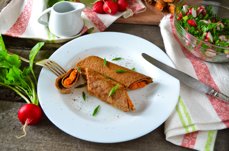 liver pancakes stuffed with carrotsの写真素材