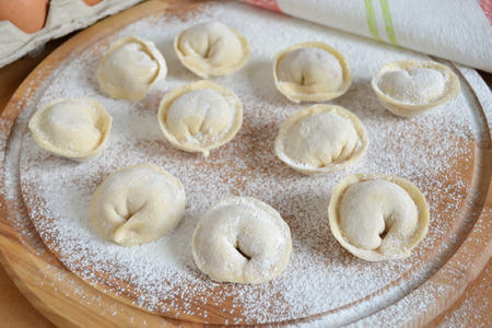 Uncooked dumplings stuffed with meatの写真素材