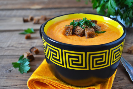 puree soup of celery and pumpkin with rye croutonsの写真素材
