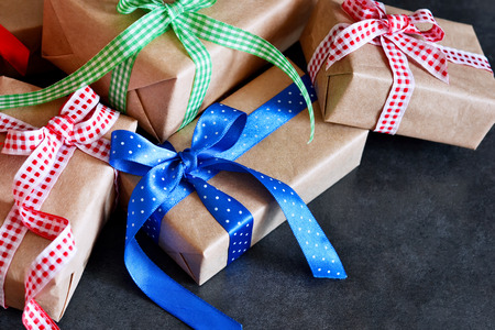 Happy New Year - Christmas gifts in boxes with ribbons on a black backgroundの写真素材