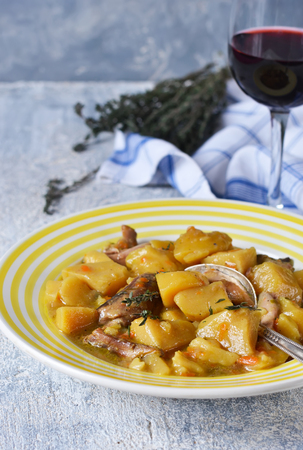 Roast meat and Temyan on concrete background with red wineの写真素材