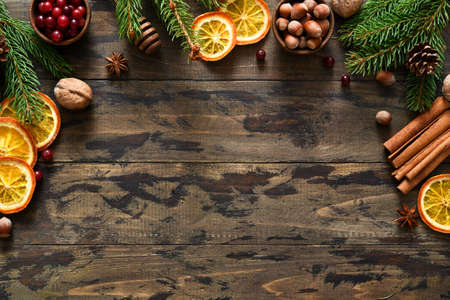 New Year card with Christmas decoration and place for text on a wooden background.Christmas baking.の写真素材