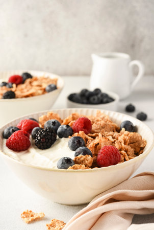 Breakfast with yogurt cereals and berries.の写真素材